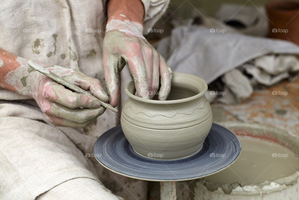 Close-up of person hand making pottery