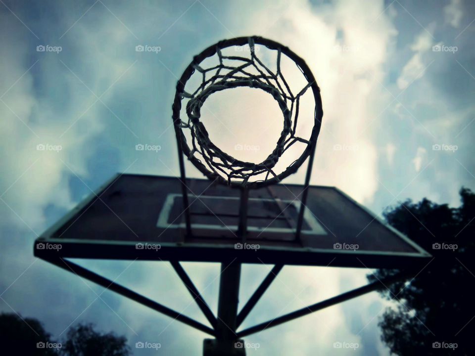 Basketball hoop in a cloudy day