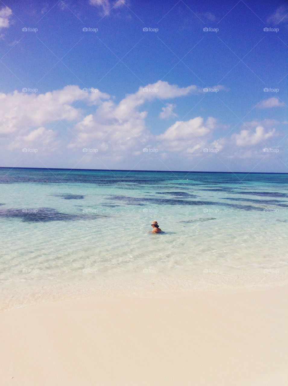 A woman in clear water.