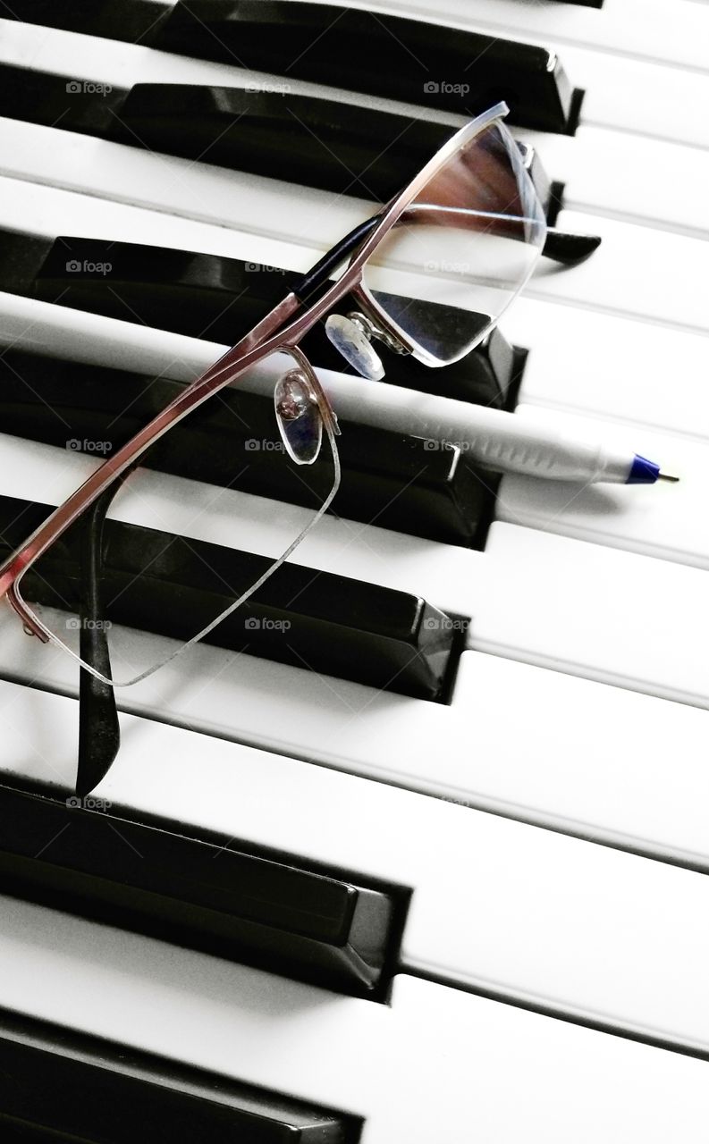 Piano and eyeglasses