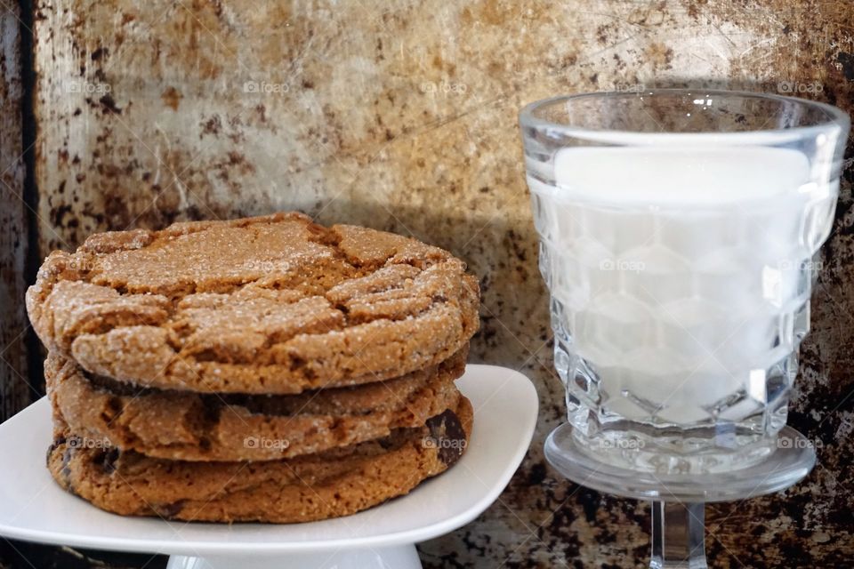 High angle view of cookie and milk