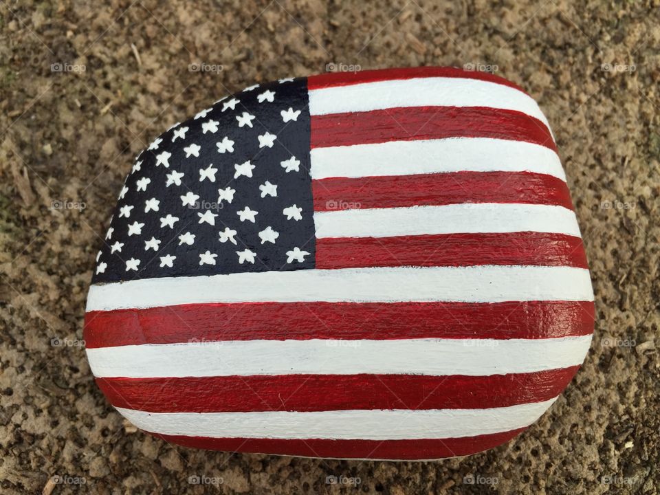 USA flag painted on a stone