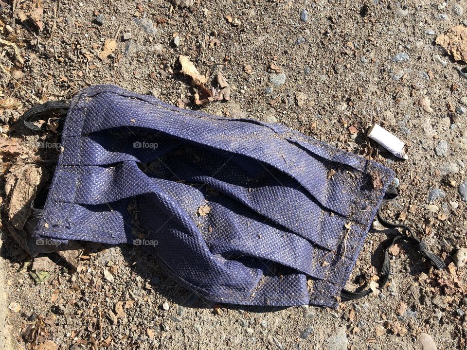 used mask discarded on the ground, pollution, garbage, covid, coronavirus, disrespect, ignorance