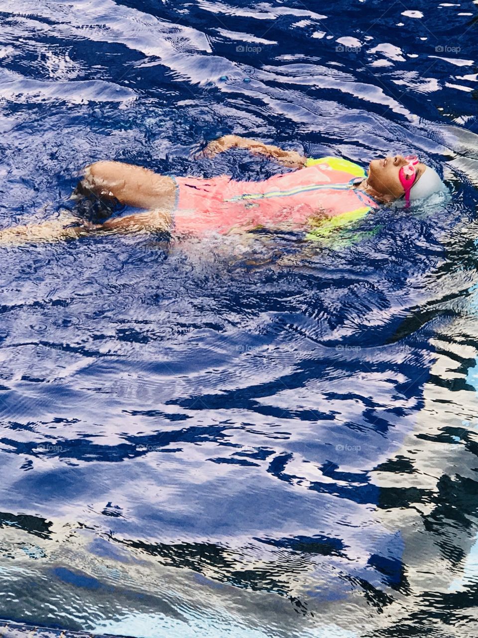 A boy swims at pool after his school to maintain good health 