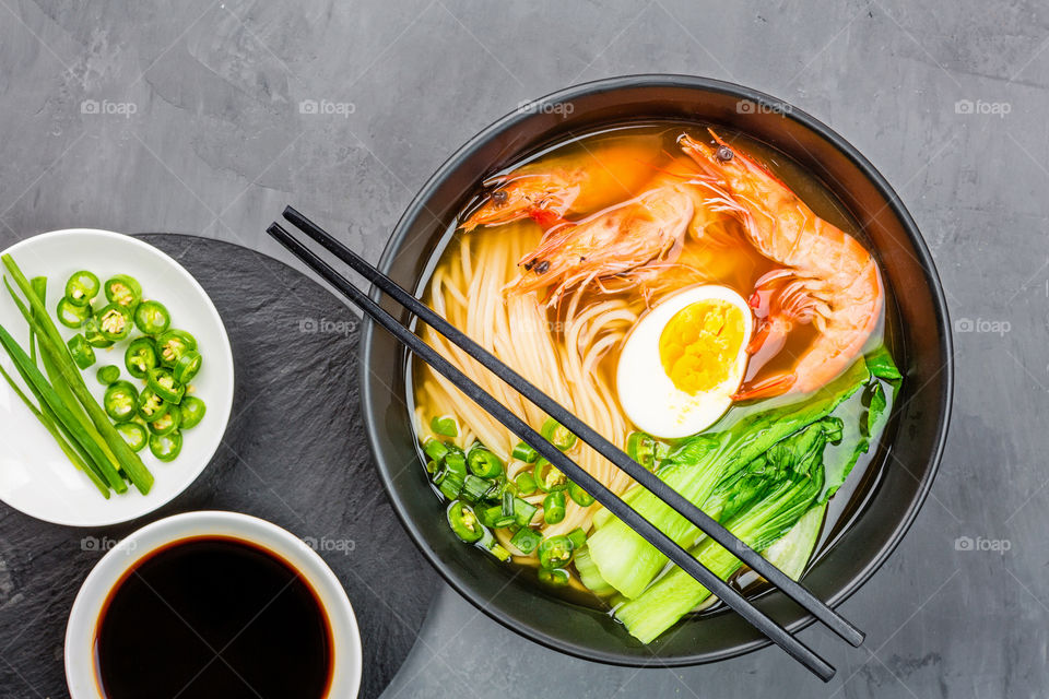 Flat lay of Chinese noodles with shrimp and egg