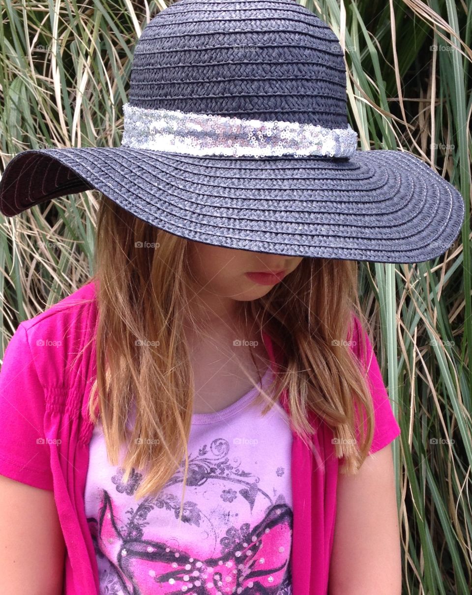 Thoughts of Summer. Girl in Summer beach hat