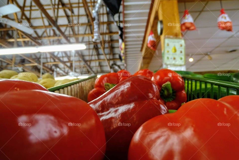 Red bell peppers at a produce stand