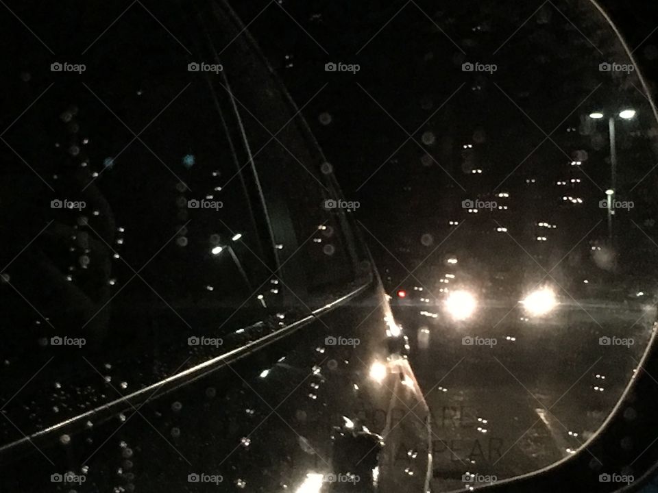 Lights in the mirror in the rain