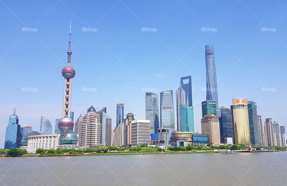 The skyline of Shanghai's Lujiazui finance district, featuring Oriental Pearl Tower and Shanghai Tower. Taken in May 2018.