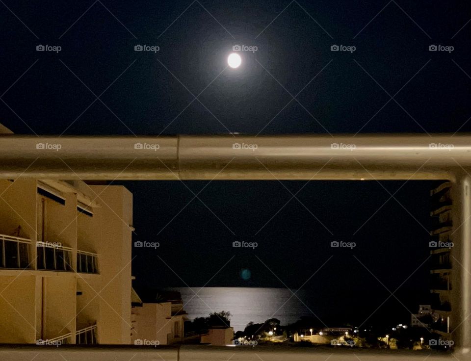 Moonlight with reflection on sea from a balcony