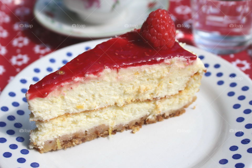 A slice of rasberry cheesecake.