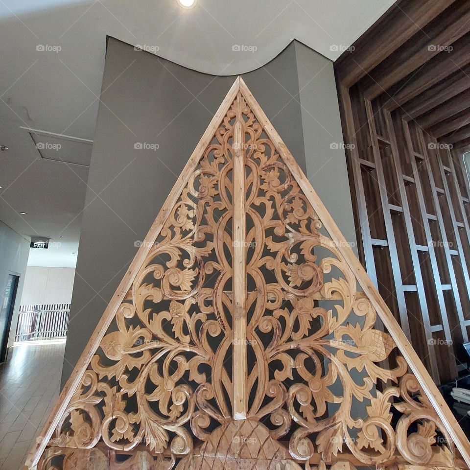 Puppet engraving mounted on the side of the room