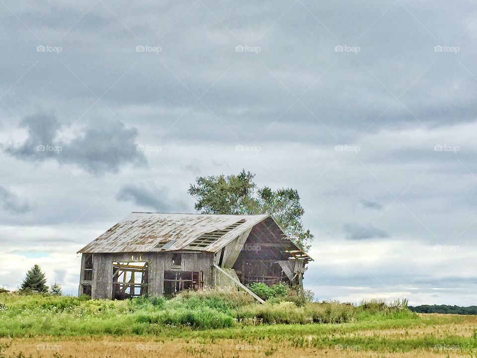 Dilapidated barn and clouds 
