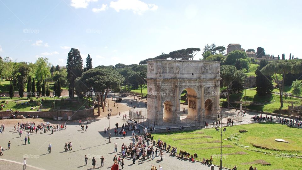 View from the Colosseum. Looking out from the Roman Colosseum onto crowds of tourists near the Arch of Constantine
