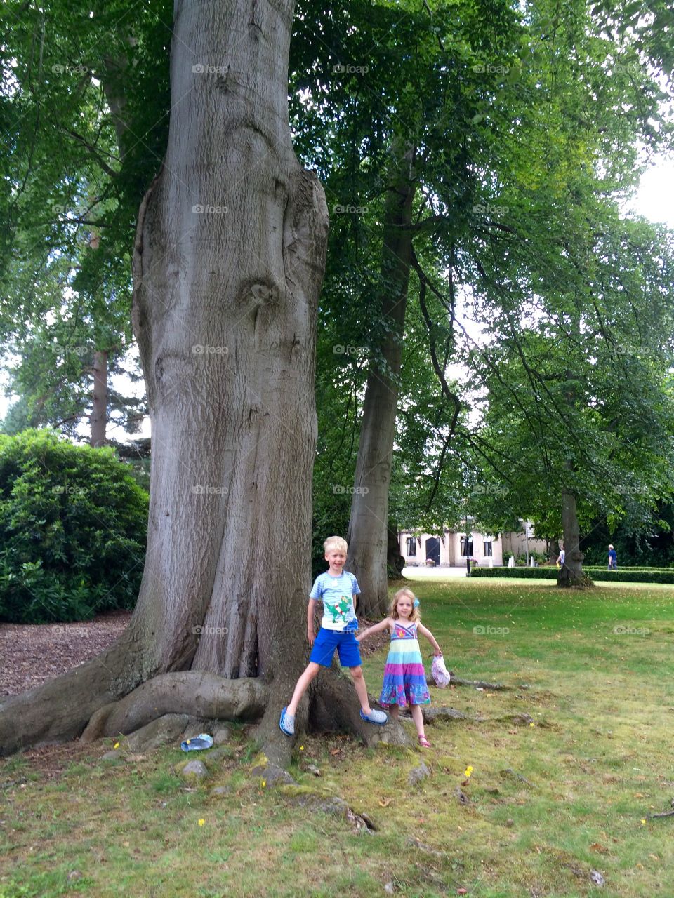 Boy and girl standing park