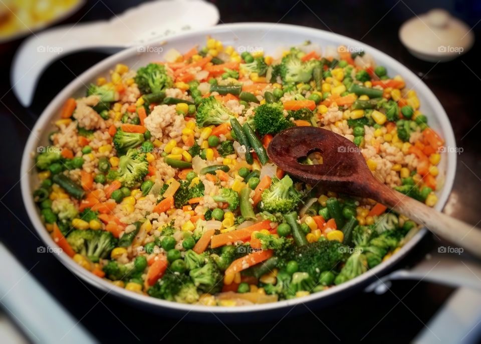 Fixing my family a healthy lunch or dinner of vegetable fried rice is a habit or routine in my life