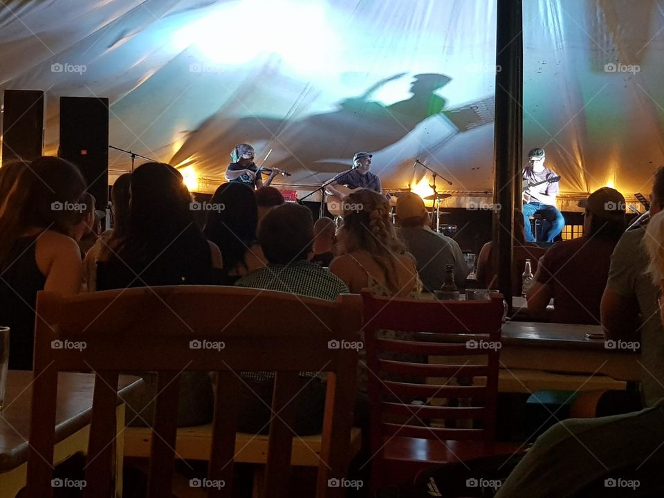 music festival under a huge tent.