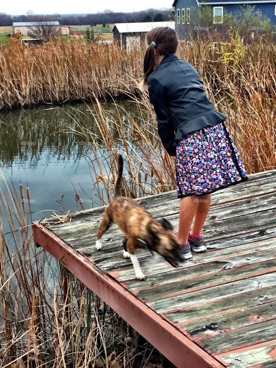 Girl and Dog by Pond