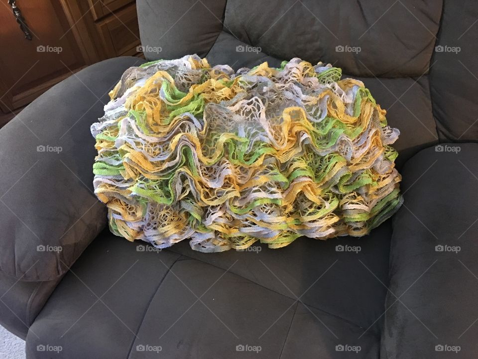 Knitted pillow on a chair 