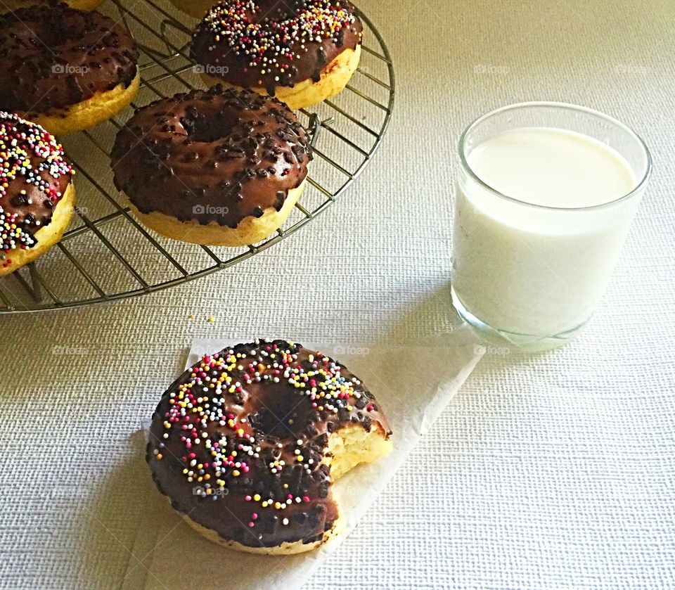 Chocolate doughnuts with milk