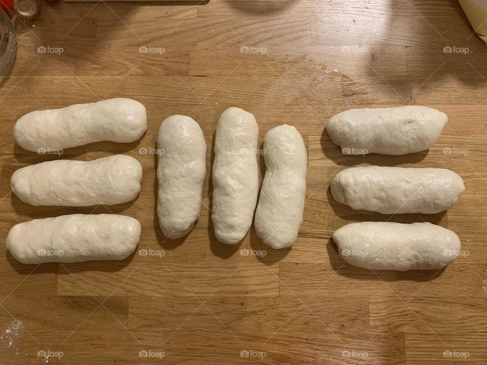 Nine long pieces of dough to make Chala bread