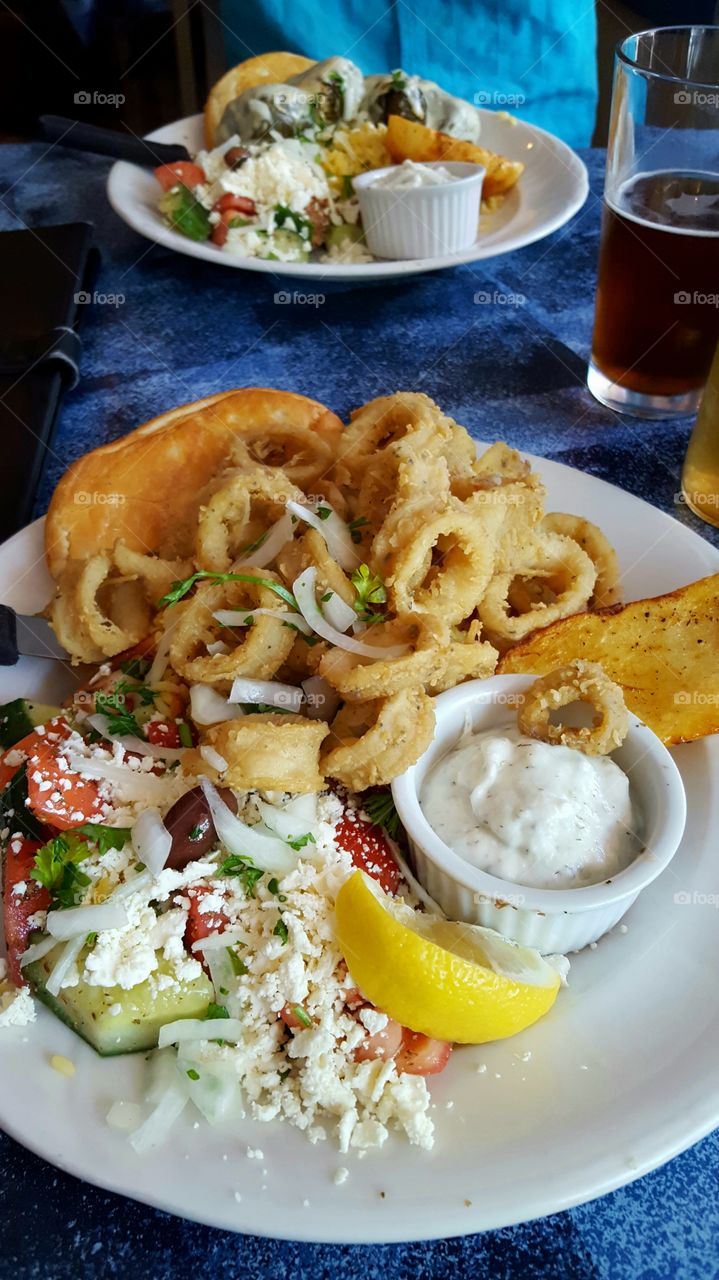 Greek food in plate on table