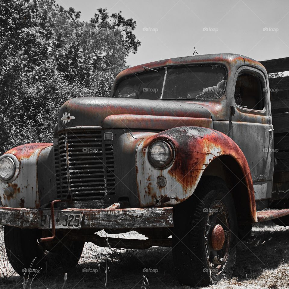 Old International truck in a field