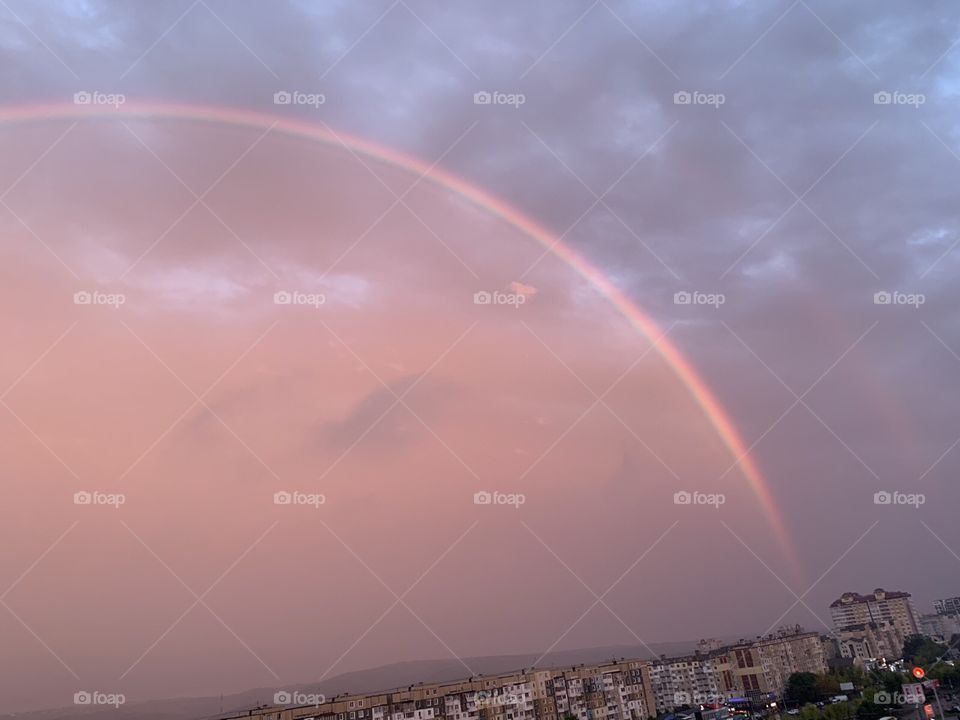 rainbow after rain at sunset