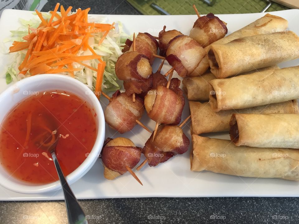 Spring rolls and bacon wrapped scallops