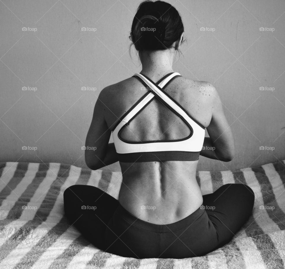 girl training yoga indoor black and white background