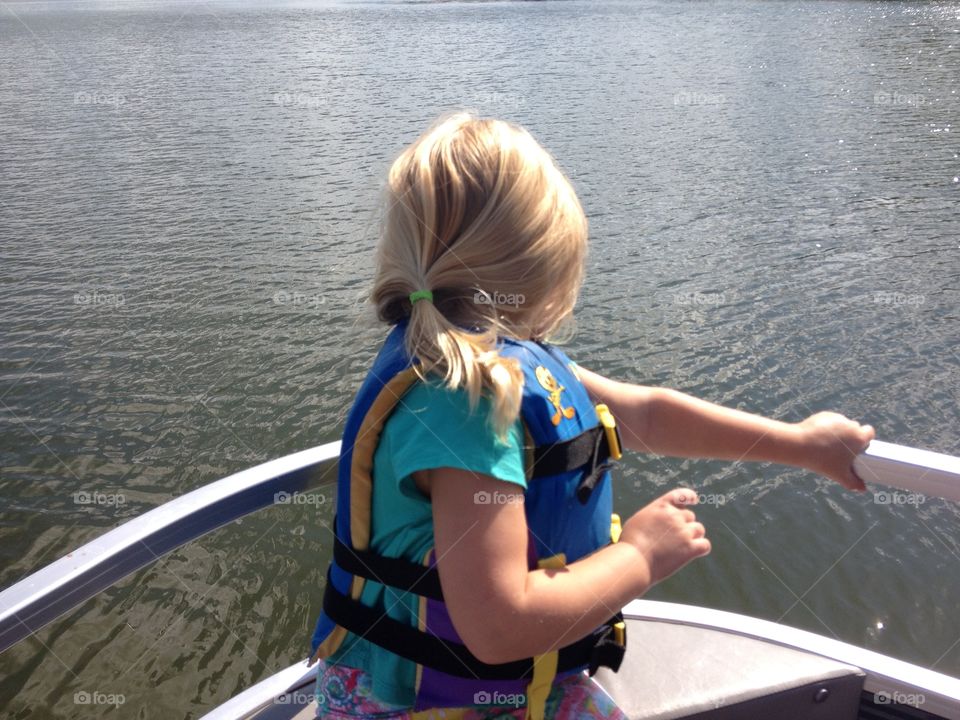 Child boating. My daughter enjoying the day on the pontoon on lake bemidji Minnesota 