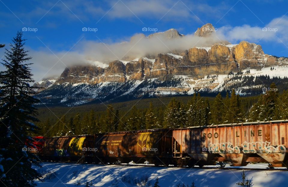 Train near snowy mountain