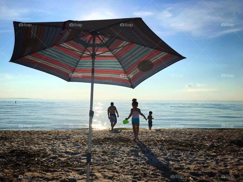 Enjoying the day in the beach with family... Sun, Sea, Sand... Children playing... Summer time... 