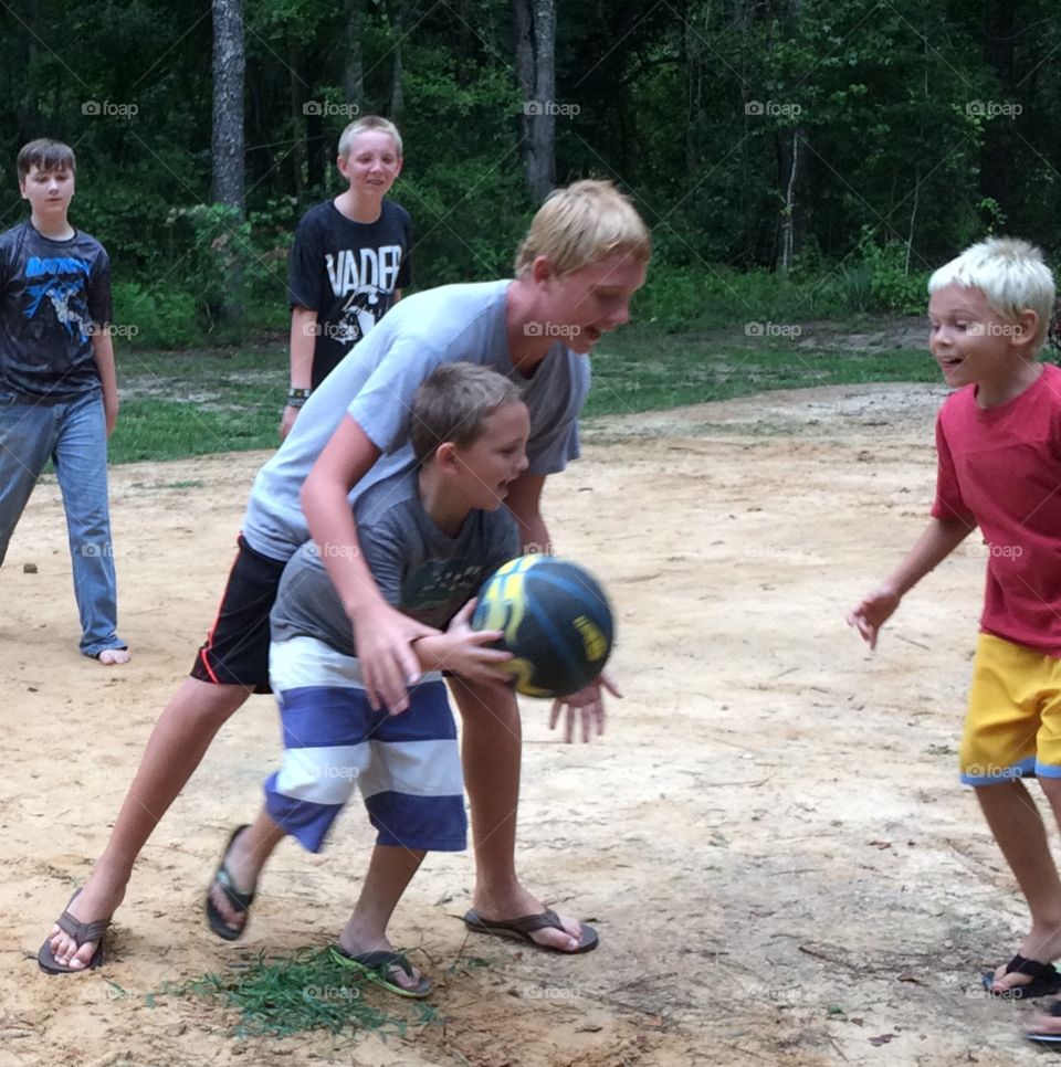 Boys playing basketball 