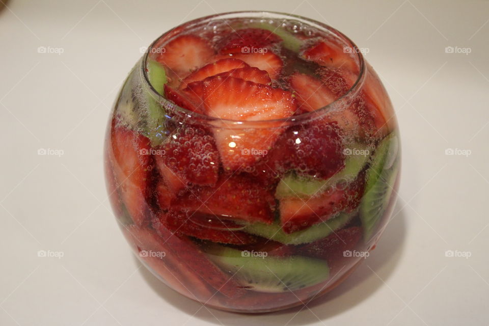 fizzy berries in glass bowl