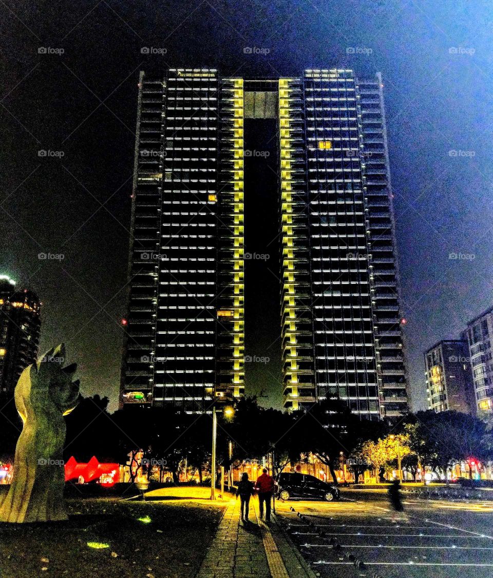 Shapes: rectangle.This rectangle skyscraper is a local famous building. this is nightscape from opposite art park.
