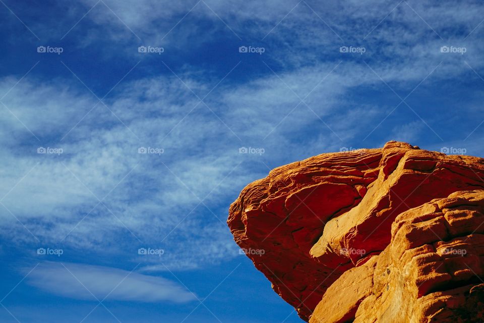 Low angle view of rock and sky
