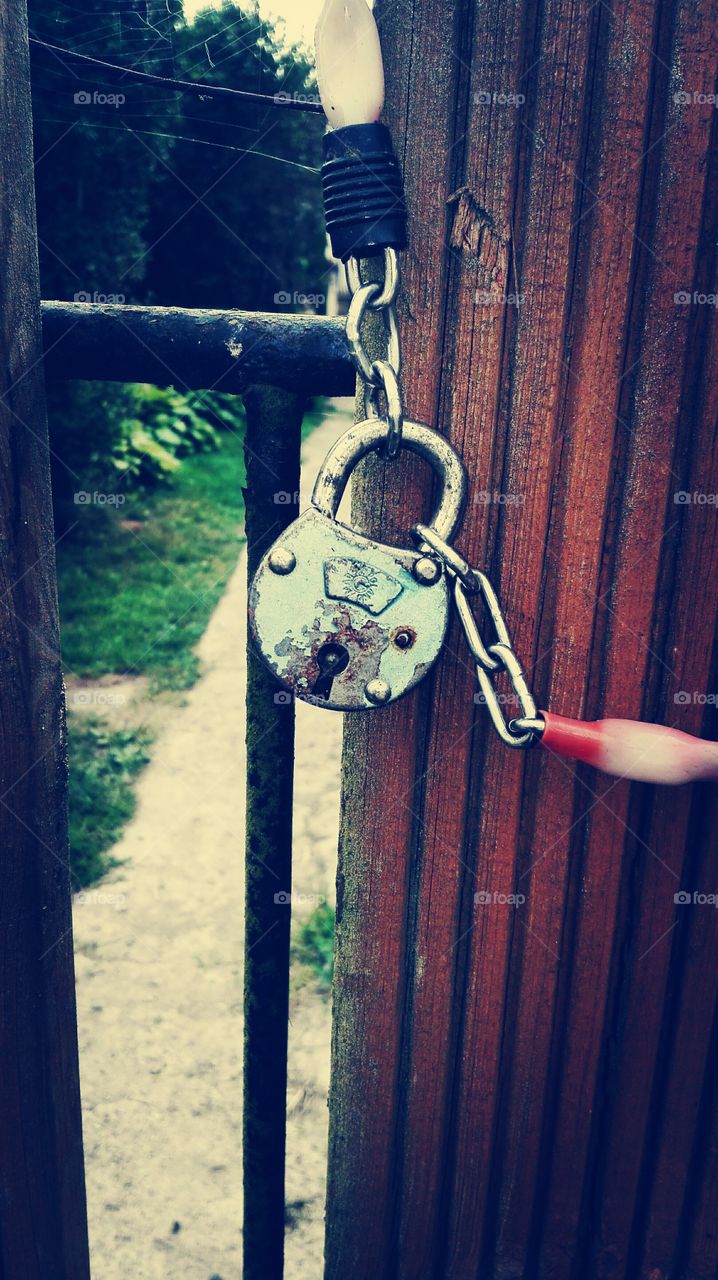 Padlock on the gate to the house.
