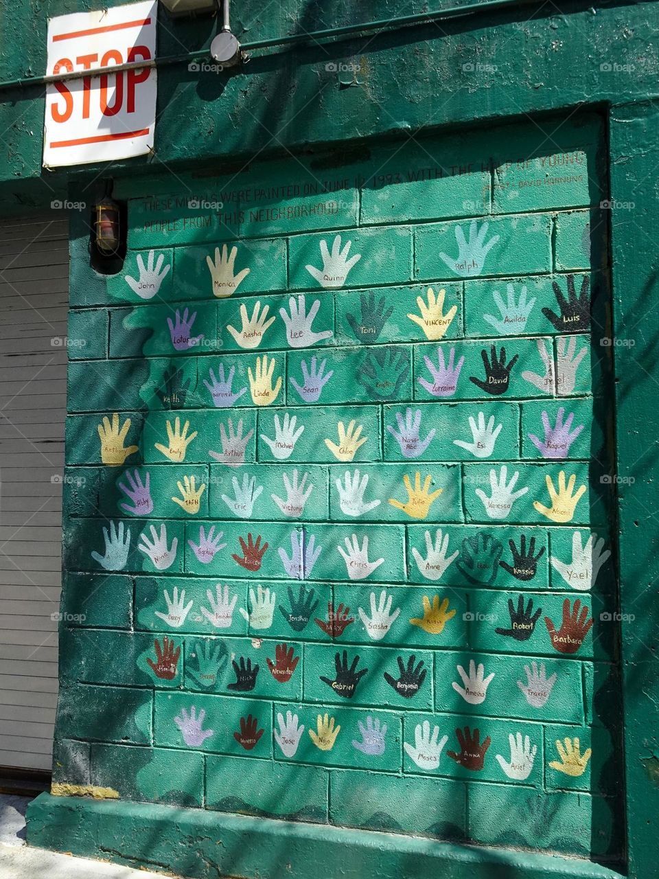 Colorful hands on the wall