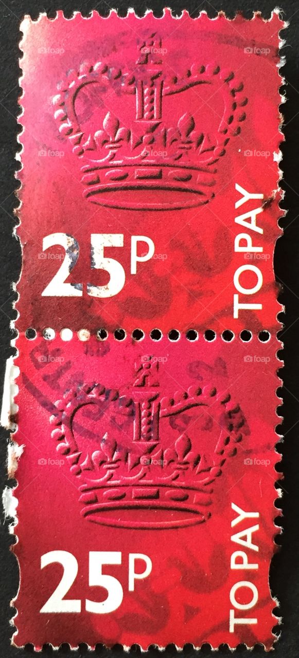 Double British stamp in red with British crown and text to pay