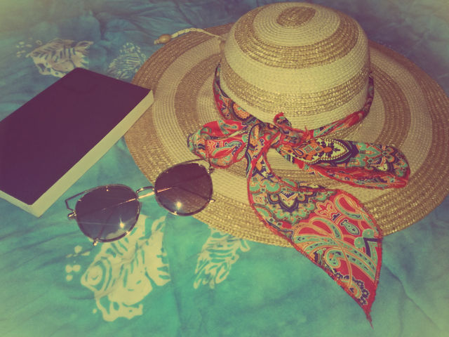 girly stuff for beach. book, sunglasses and hat