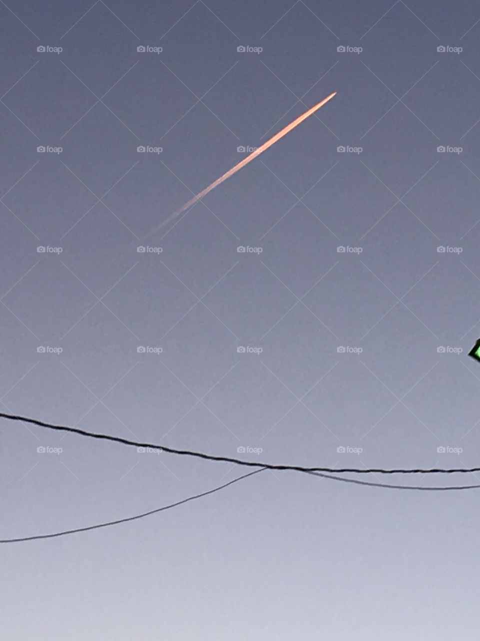 Jet flying over on a beautiful day. What a great day to fly! This is one of several jets in the sky.