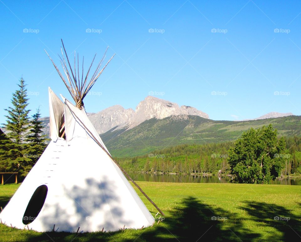 teepee in front of Mount yamnuska, just outside Calgary, Alberta.