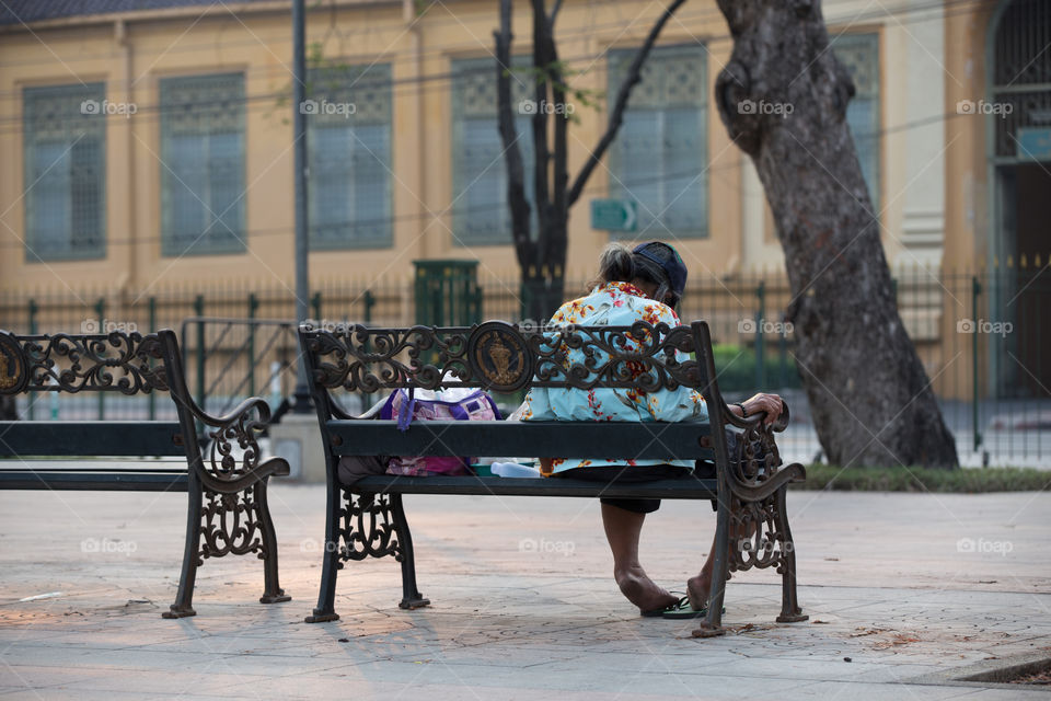 Old woman sitting in the park