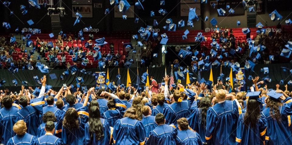High School graduation , throwing of the caps after announcing the class of 2016. 
