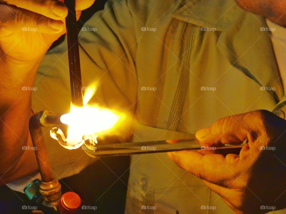 Master Artisan Shaping Glass With A Torch