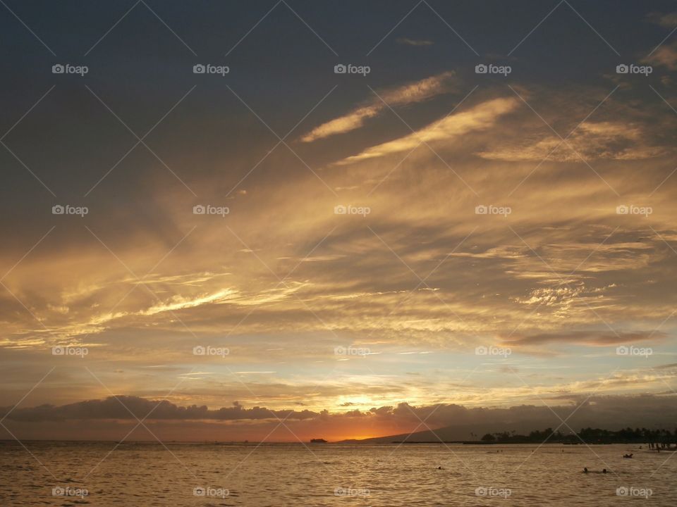 Sunset beyond the clouds. Hawaiian sunset