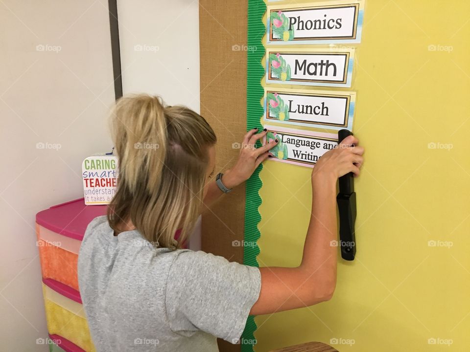 Teacher preparing a classroom 