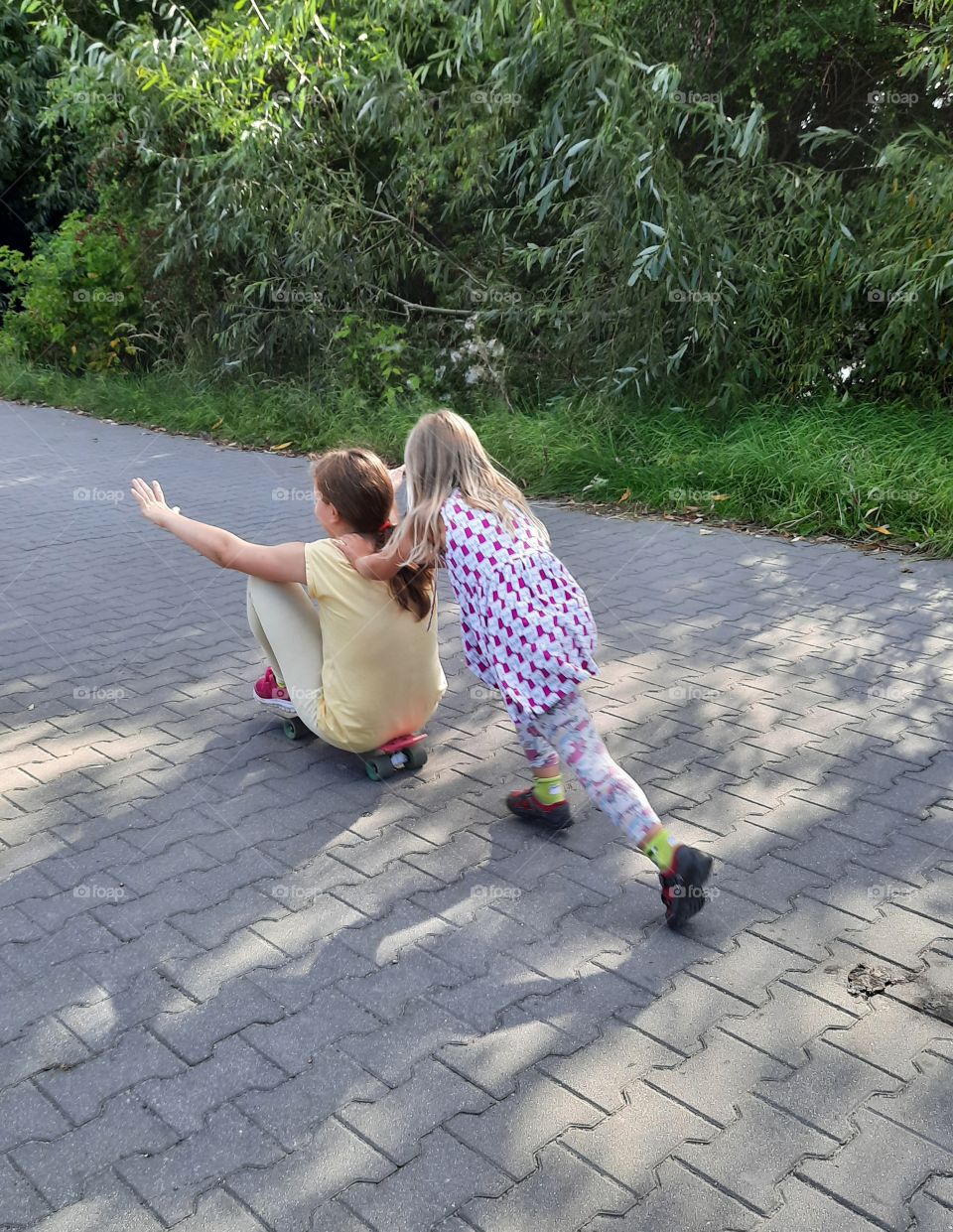 happy kids playing on local road