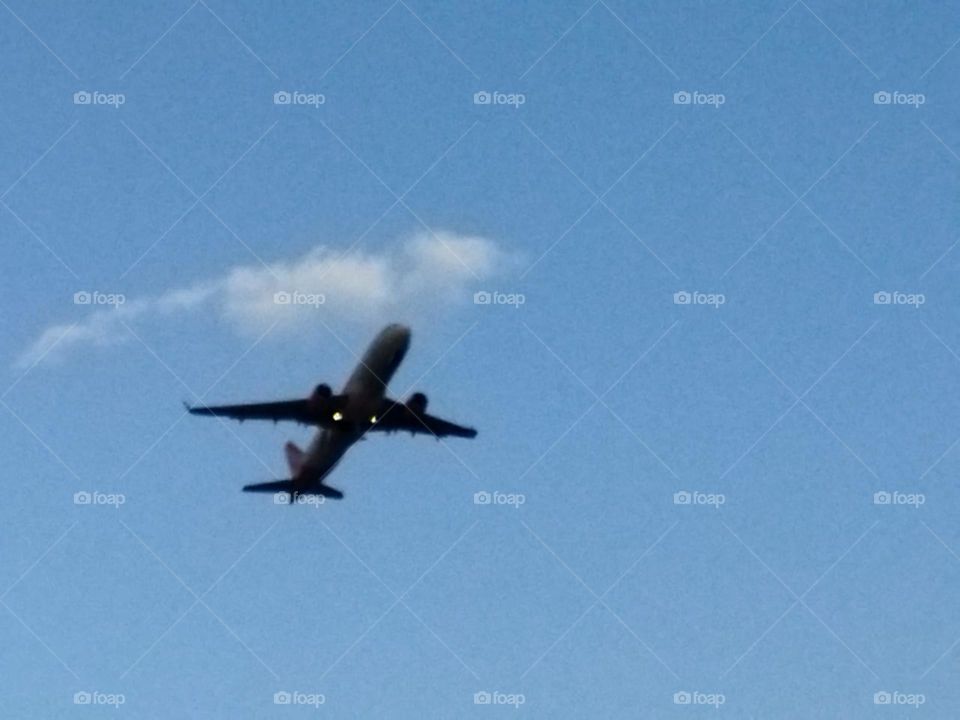 Beautiful airplane flying cross the sky